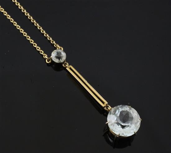 An early 20th century 9ct gold and aquamarine drop pendant necklace, chain 16in.